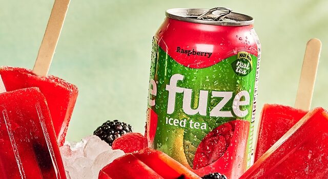 Raspberry iced tea is transformed into fruity popsicles with berries.