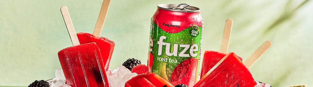 Raspberry iced tea is transformed into fruity popsicles with berries.